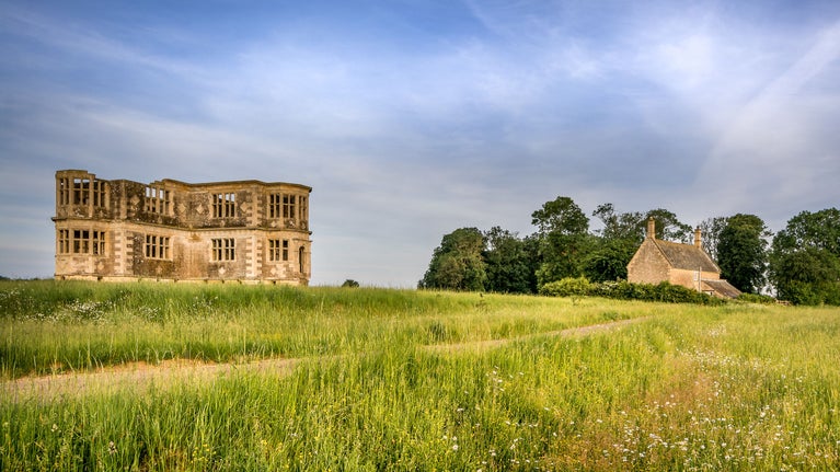 Lyveden Cottage, overlooked by the unfinished Lyveden Garden Lodge, Northamptonshire